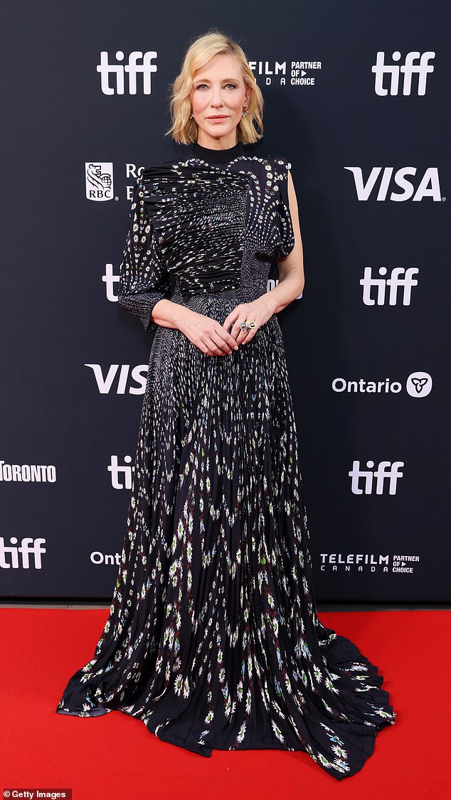 Cate Blanchett, 55, showed off her chic style in an asymmetrical black and white print dress.