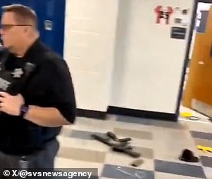 Colt Gray's AR-15-style rifle can be seen in the hallway of Apalachee High School.