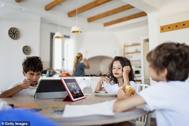 The report by pub chain Hungry Horse found that the average UK family eats together just three times a week, while 7 per cent never sit down at the same table. Only 19 per cent of the 2,000 parents surveyed dined together every day (file image)