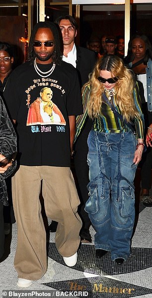 The Like A Virgin singer paired the look with a pair of baggy jeans and pointed black heels.