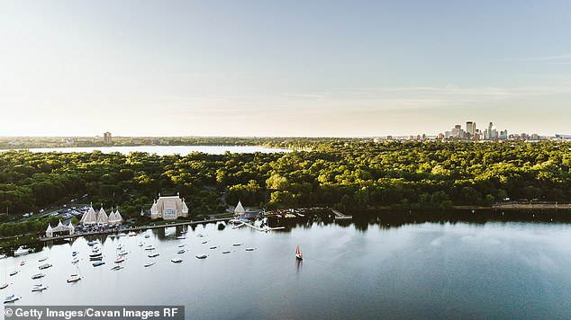 Summers in Minneapolis are not excessively hot, with average temperatures around 85°F (pictured: Lake Harriet and the Minneapolis skyline)