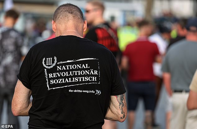 A far-right supporter wearing a T-shirt of the minority far-right party, The Third Way (Der Dritte Weg), attends a protest in Solingen on August 26.