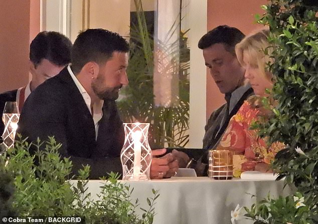 The star looked dapper as he opted for a smart suit for his final dinner and was seen sitting with friends.