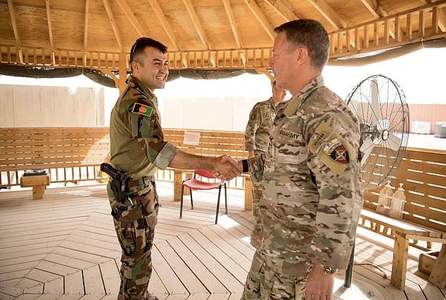 Afghan General Sami Sadat (left) greets US General Scott Miller, head of the US-led coalition in Afghanistan, in southern Helmand province in April 2021. 