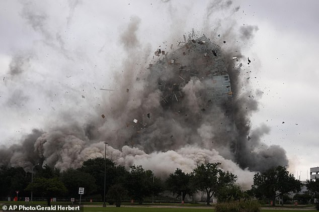 The skyscraper collapsed on Saturday in a huge cloud of dust into a pile about five stories high.