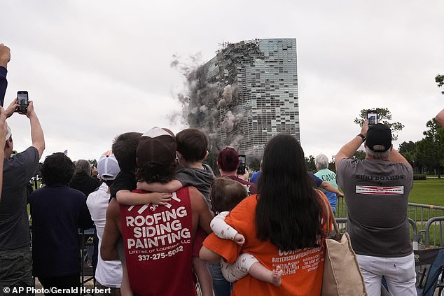 Residents watch the implosion of the Hertz Tower on Saturday, Sept. 7, 2024. The once-iconic skyscraper became a symbol of destruction in Lake Charles after it was devastated by back-to-back hurricanes nearly four years ago.