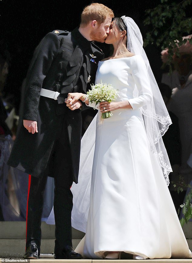 Clare Waight Keller, former creative director of Givenchy, was the designer of Meghan Markle's wedding dress (pictured: Prince Harry and Meghan Markle at their wedding in Windsor in May 2018)