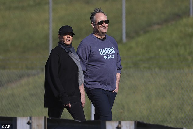 Vice President Harris and her husband Doug Emhoff walk through Pennsylvania, where Harris has been staying while preparing for the debate.