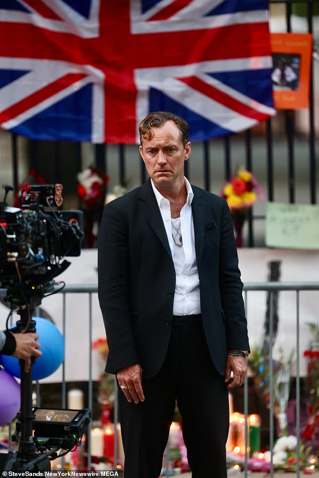 Jude looked dapper in a black suit and unbuttoned white shirt as he filmed scenes for his upcoming role in Netflix's Black Rabbit.