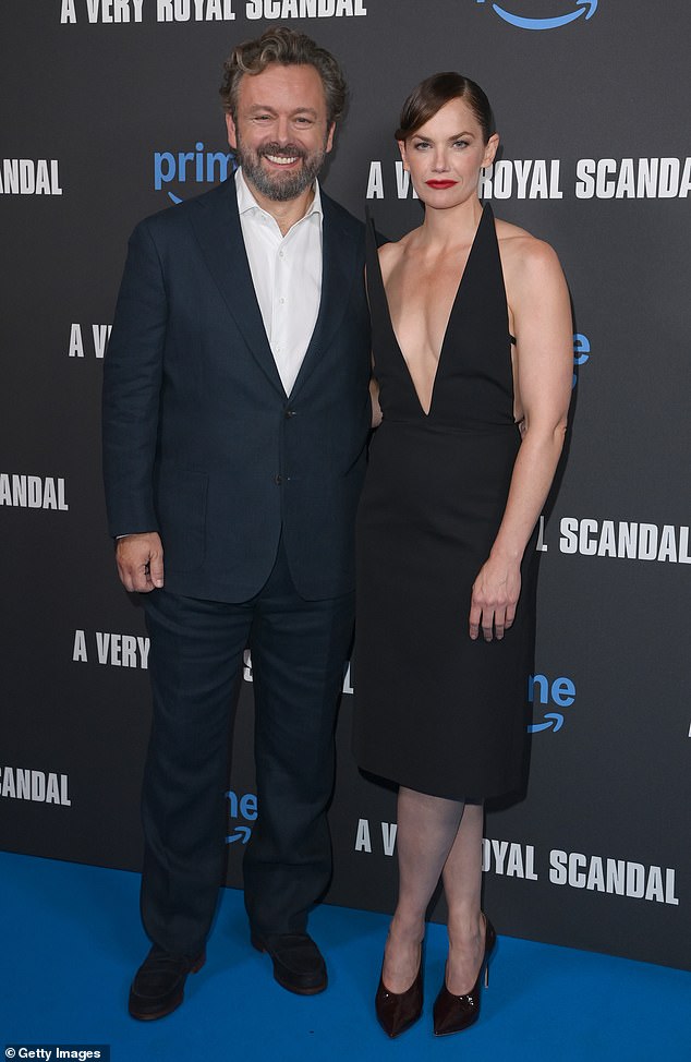 Michael looked dapper in a navy suit and white shirt as he posed alongside his co-star Ruth.