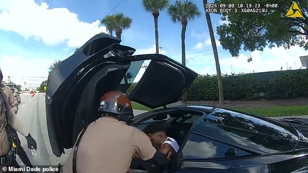 The Miami wide receiver was dragged out of his luxury car by an officer after being detained.