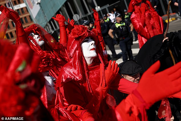 Hundreds of pro-Palestine protesters and members of activist group Extinction Rebellion (pictured) are expected to gather outside the Melbourne Convention and Exhibition Centre to protest against the 2024 Land Forces International Defence Exhibition.