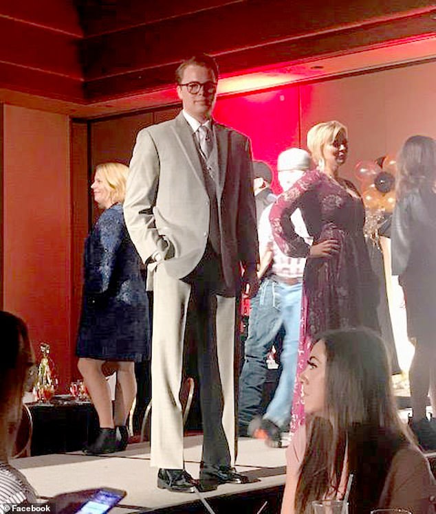 Scott is seen at a 2017 fashion show to raise funds to support the Child Abuse Network.