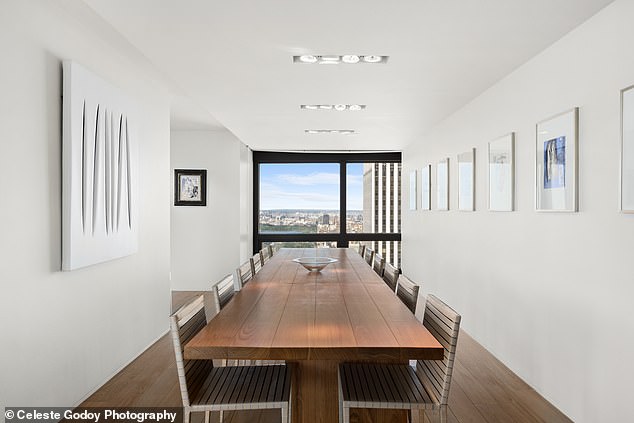 Twelve people can comfortably gather for dinner at this long dining table.