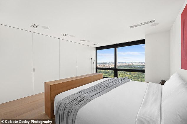 The image shows one of the three bedrooms with a postcard view of Central Park.