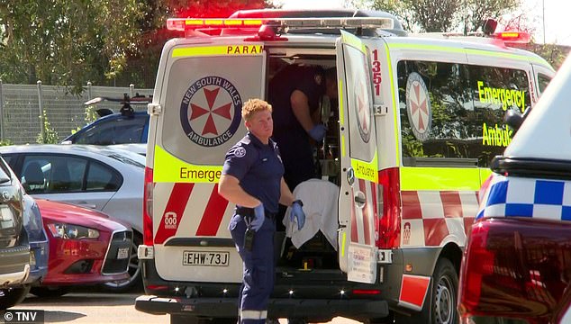 The bodies of two young children, aged 9 and 11, were discovered at the Faulconbridge home (pictured, paramedics at the scene in western Sydney)