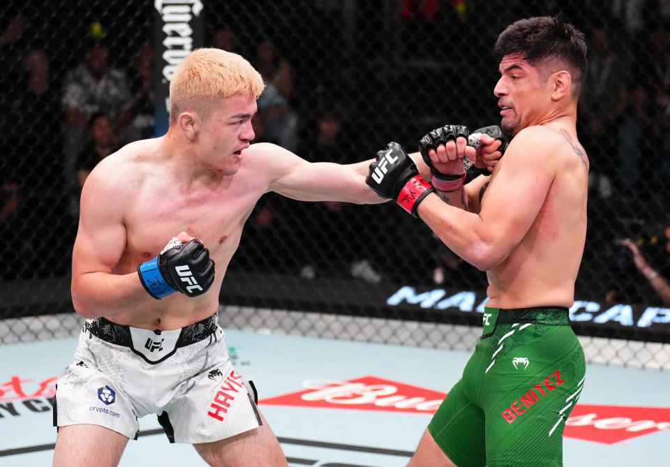 LAS VEGAS, NEVADA – APRIL 27: (L-R) Maheshate of China punches Gabriel Benitez of Mexico in a lightweight bout during the UFC Fight Night event at UFC APEX on April 27, 2024 in Las Vegas, Nevada. (Photo by Chris Unger/Zuffa LLC via Getty Images)