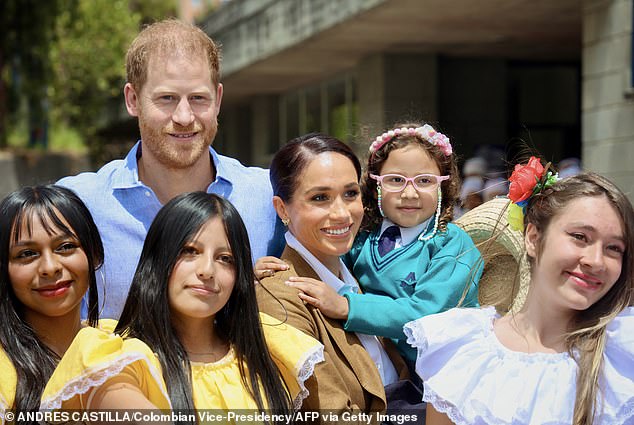 The Duke and Duchess of Sussex with students from La Giralda school in Bogotá on August 16