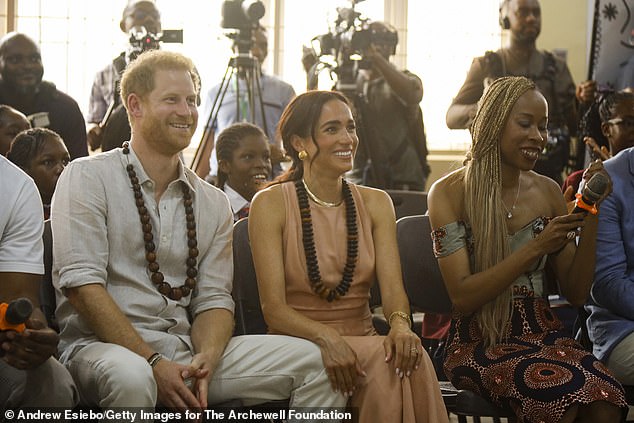 Prince Harry and Meghan Markle visit the Lightway Academy in Abuja, Nigeria on May 10