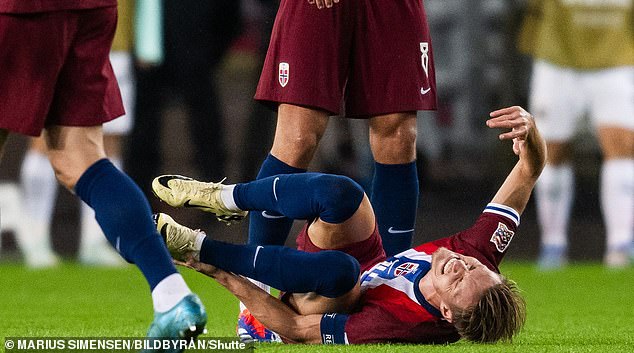 The midfielder appeared to be in agony after a challenge from Christoph Baumgartner.