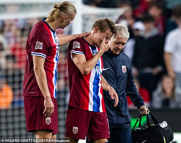 Erling Haaland was among the players who consoled Odegaard, who appeared to be in tears.