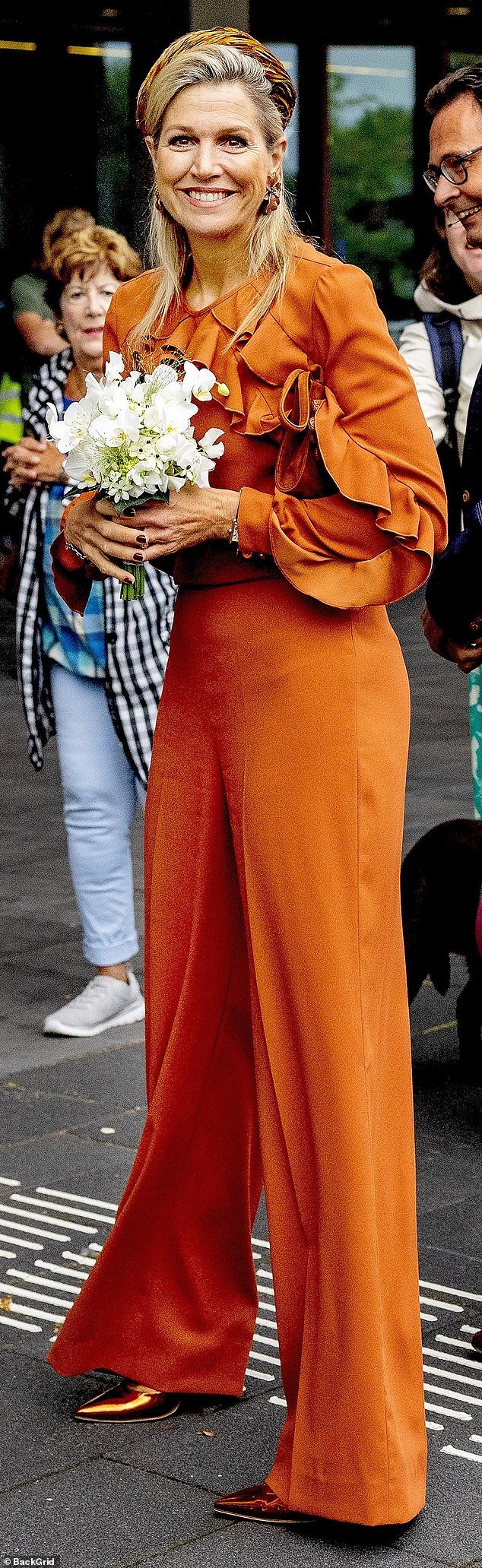 The royal mother of three looked sophisticated in a burnt orange ensemble as she opened the new walk-in clinic.