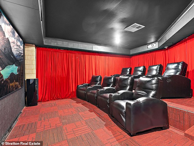 The renovated home, which features three living rooms and a theatre (pictured), is expected to fetch more than $1 million after being purchased for just $525,000 in 2015.