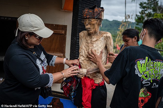 Every four years, the Toraja people unearth the graves of their ancestors to meticulously care for their bodies.