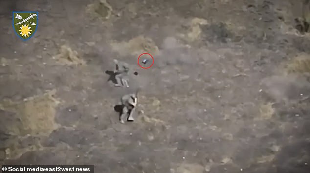 The small FPV drone was seen flying menacingly around the two soldiers, who were seen firing frantically at it.