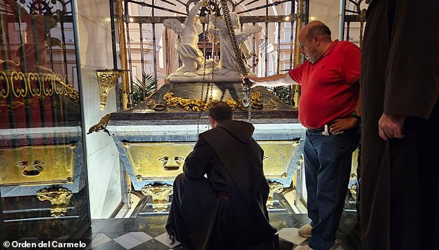 Saint Teresa of Avila died in 1582 and her body has remained virtually unchanged since then. Pictured: The silver coffin covered in marble of Saint Teresa of Avila