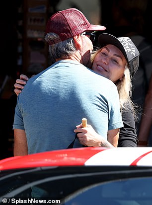 Wolfe and Cline were spotted grabbing coffee at their coffee shop before stopping by a car and coffee event.