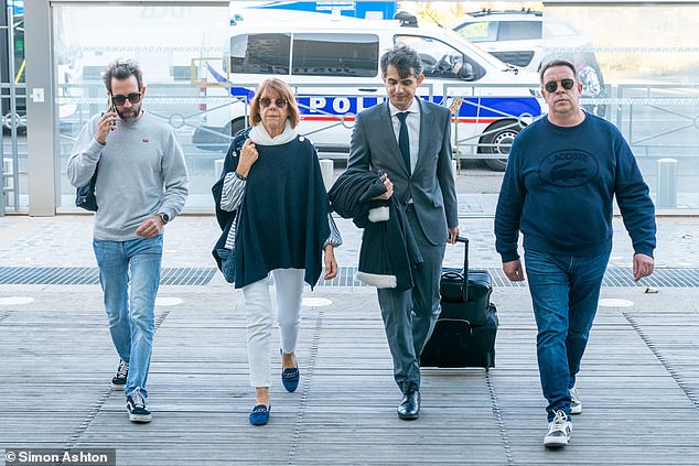 Gisele Pelicot arrives at the court in Avignon, France, on Tuesday, accompanied by her sons Fliran (left) and David (right)