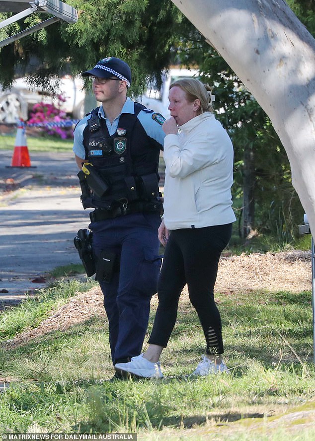 Residents began placing tributes at the home on Wednesday as detectives continued to investigate the scene.