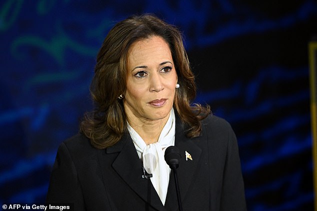 US Vice President and Democratic presidential candidate Kamala Harris listens to former US President and Republican presidential candidate Donald Trump speak