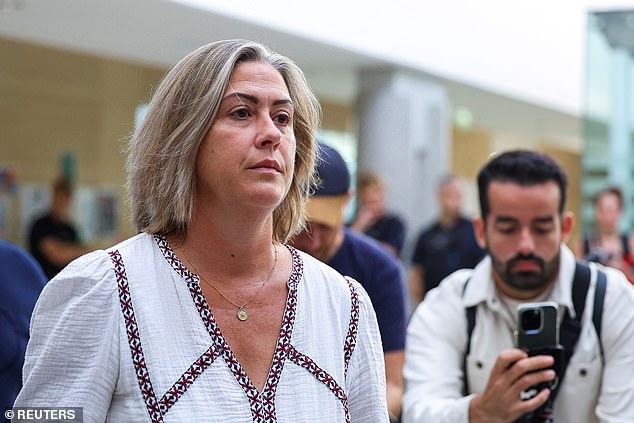 Caroline, the daughter of Gisele Pelicot, who was allegedly drugged and raped by men at the request of her husband Dominique Pelicot, walks in court in Avignon, France, on Tuesday.