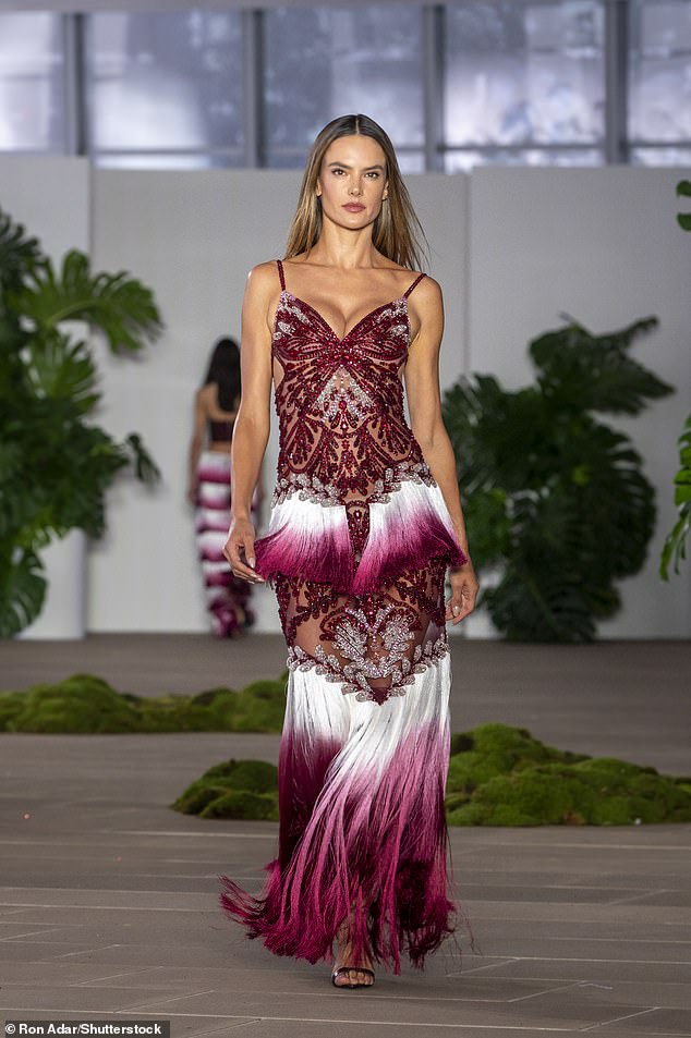 The glamorous garment featured cutouts to show off her toned figure while vibrant tassels lined the beaded skirt.