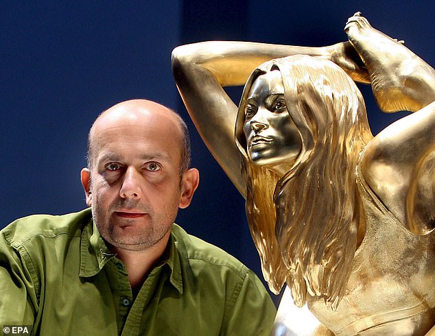 British artist Marc Quinn poses with his solid gold sculpture of British supermodel Kate Moss at the British Museum