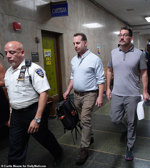 Wicks (right) is seen leaving court Tuesday with her husband after her arraignment in Manhattan Criminal Court.