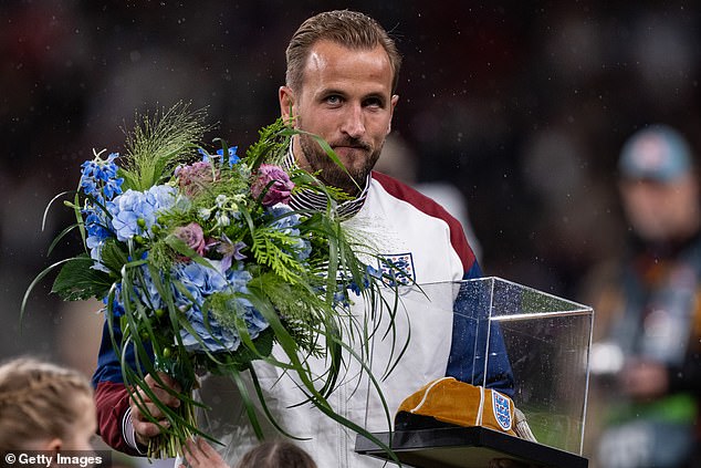 Kane was presented with a gold cap to commemorate his 100th game for the Three Lions