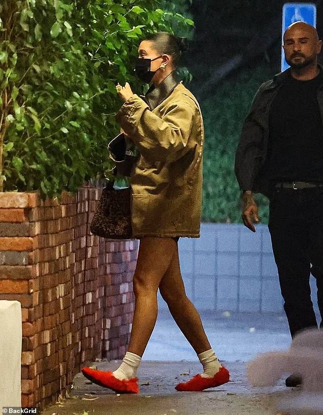 Hailey paired her casual look with white socks and furry red flats.