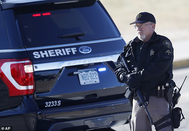 Officers said they managed to recover the firearm used in the shooting from inside Metz's truck. A member of the department is seen here during an incident in 2018.