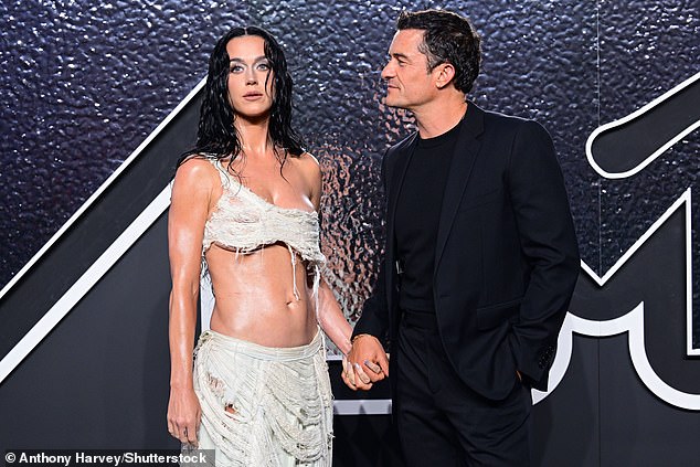 Orlando, who shares daughter Daisy with Katy, looked at her adoringly as they held hands on the red carpet.