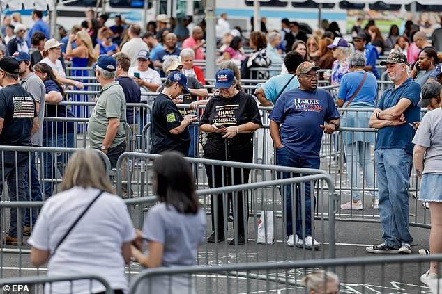 Attendees wait outside Bojangles Arena in Charlotte, North Carolina, for Kamala Harris' rally on September 12. Supporters near the front of the line told DailyMail.com they arrived around 9:30 a.m. to get in.