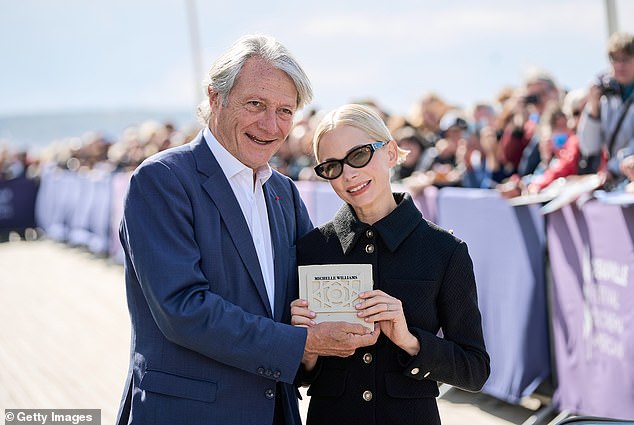 1726177601 516 Michelle Williams receives her beach hut at the 50th Deauville