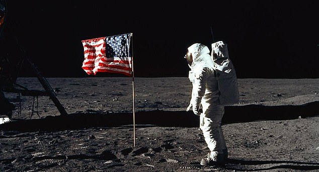 The American flag appears to be waving in this photograph because a telescopic pole has been inserted along the top edge of the flag.