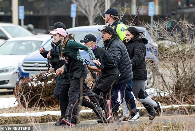 King Soopers employees are led away from the massacre at the grocery store in March 2021