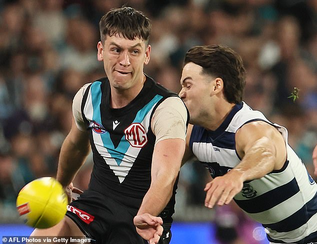 Butters (left) was substituted in Port Adelaide's heavy defeat to Geelong with a rib injury.