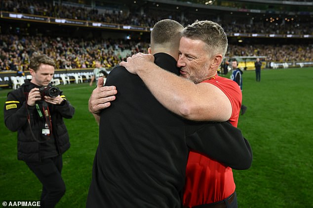 In that game, the Tigers faced the Suns, and Hardwick hugged his great friend (pictured) as they marked the supposed end of his AFL playing days.