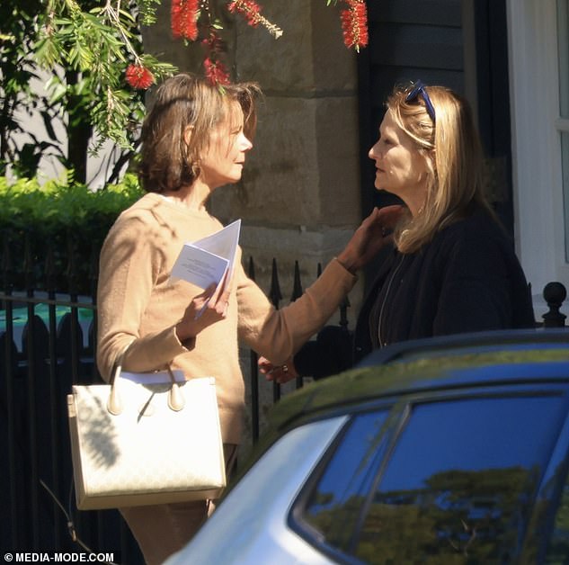 Australian actress Nicole Kidman's younger sister was comforted by two women outside her home