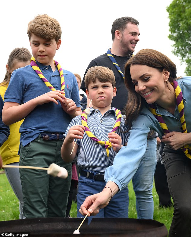 Prince George and Prince Louis enjoying a toasted marshmallow as Kate toasts one in Slough last year